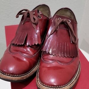 Salvatore Ferragamo Red Leather Fringe women's derby shoes (brogue style)